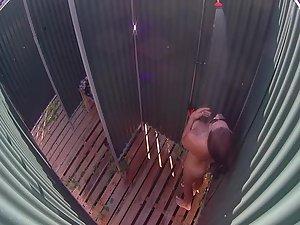 Sexy woman in a beach shower cabin Picture 2