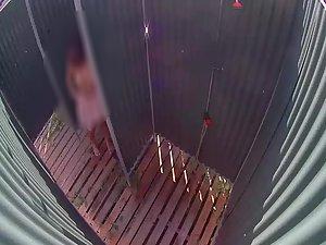 Sexy woman in a beach shower cabin Picture 5