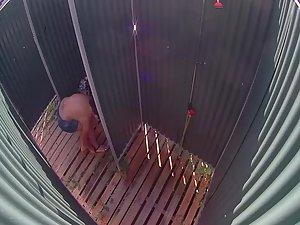 Sexy woman in a beach shower cabin Picture 8