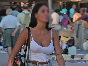 Voyeur zooms in on her kissable face and big boobs Picture 1