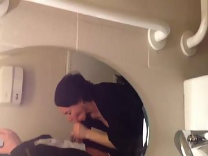 Classy babe sucks her man in a toilet Picture 3