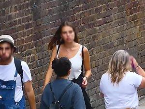 Busty girl walks and licks her lips Picture 1