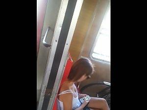 Downblouse of young tits in train Picture 1