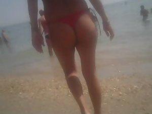 Topless girl in a red thong Picture 1