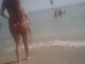 Topless girl in a red thong Picture 2