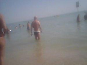 Topless girl in a red thong Picture 4