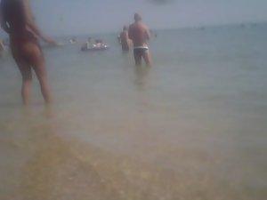 Topless girl in a red thong Picture 8