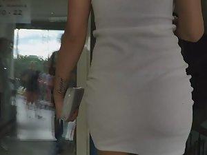 Seductive walk in tight white dress Picture 5