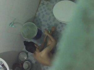 Peeping over the wall on asian girl washing herself Picture 5