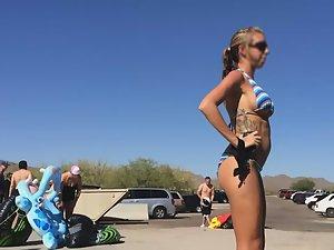 Tiny bikini can't cover her big fake boobs Picture 4