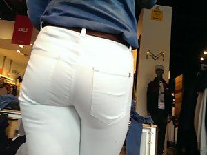 Store worker in tight white pants