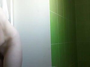 Slim girl undresses and showers in front of hidden cam Picture 2