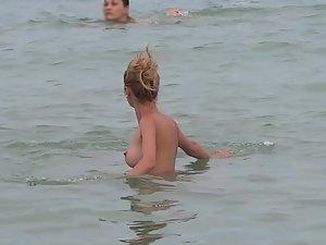 Petite nudist girl washes her ass from the sand Picture 8