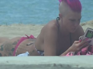 Punk girl is an unique sight on beach