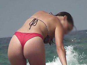 Sensational ass in red thong bikini