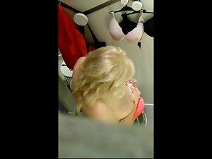 Peeping on huge mature breasts in fitting room Picture 2