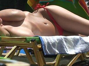 Big boobs and pussy slip of seductive girl at beach Picture 2