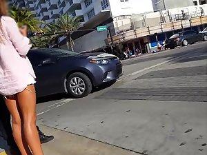 Gorgeous tanned legs of hot girl on the street Picture 7