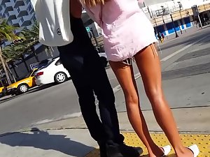 Gorgeous tanned legs of hot girl on the street