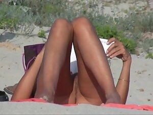 Nudist girl looks fuckable when she reads a book on beach Picture 3