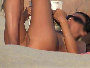 Nudist girl looks fuckable when she reads a book on beach Picture 8