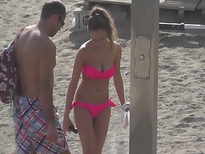 Beauty in pink bikini with boyfriend