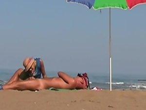 Hot lady gives a handjob at a beach Picture 2