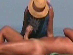 Hot lady gives a handjob at a beach Picture 3