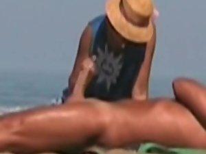 Hot lady gives a handjob at a beach Picture 6