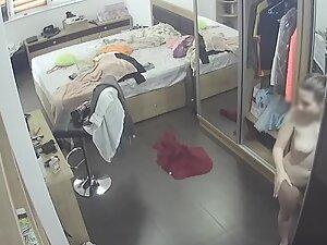 Spying on naked girl admiring herself and getting dressed Picture 4