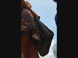 Wind shows her thong and bra in upskirt Picture 5
