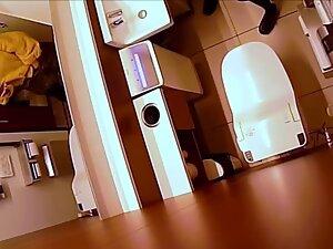 Hidden cam caught her finger pussy in a restroom Picture 1