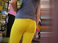 Thongs peeking out of her yellow pants Picture 4