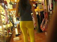 Thongs peeking out of her yellow pants Picture 6