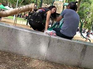 Visible thong of sexy milf on the playground Picture 1