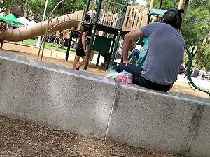 Visible thong of sexy milf on the playground Picture 2