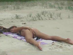 Spying a girl fingering herself at a beach Picture 4