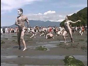 Bunch of nudists exercising on the beach Picture 2