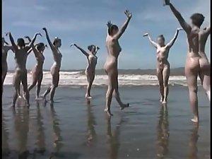 Bunch of nudists exercising on the beach Picture 5
