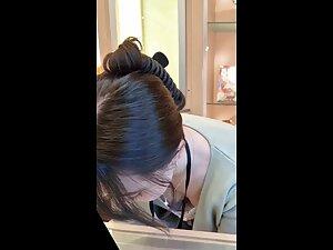 Hot downblouse of store clerk in glasses store Picture 1