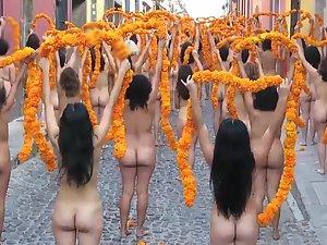 Public nudity with orange flowers on the street Picture 2