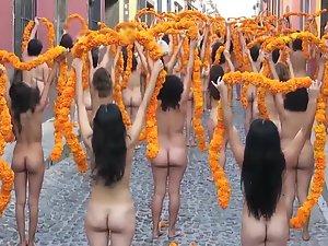 Public nudity with orange flowers on the street