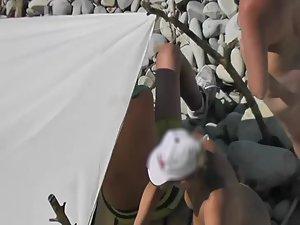 Mature nudist woman repairs the tent Picture 3