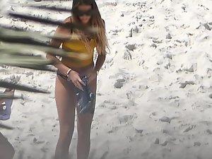 Two sexy girls removing their shorts on beach Picture 5