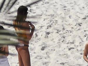 Two sexy girls removing their shorts on beach Picture 6