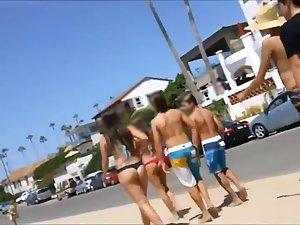 Following girls in thong bikinis to beach Picture 6