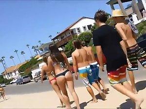 Following girls in thong bikinis to beach Picture 7