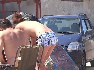 Nudist woman bends over by her tent Picture 6