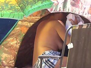 Nudist woman bends over by her tent Picture 8