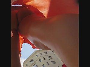 Tanned ass and thong in very deep upskirt look Picture 6
